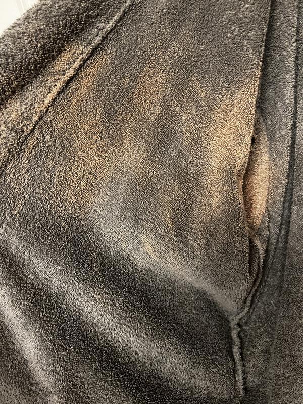 Inside under arms and at back