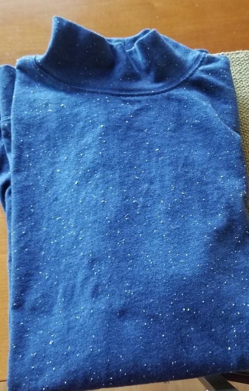 Looks like washed with tissue - but that is the fabric.   pretty awful