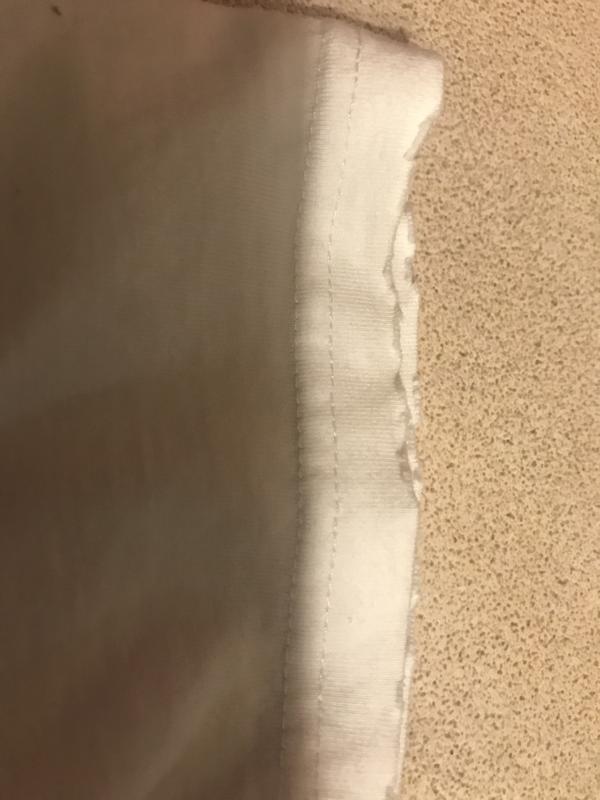 Frayed ends of shirt.