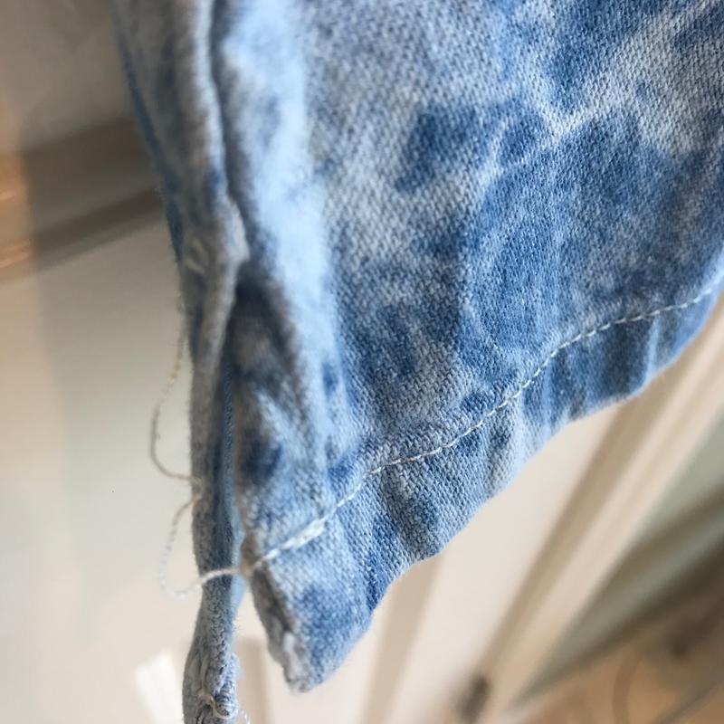 More sloppy stitching at the bottom, and at the top of the vent seam.