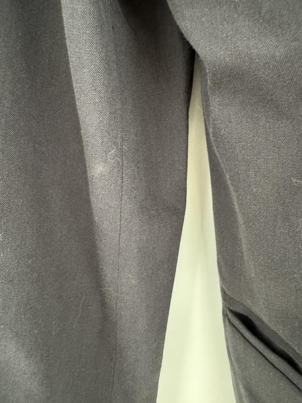 the blazer was tagless, had stains and looked like it had been worn.