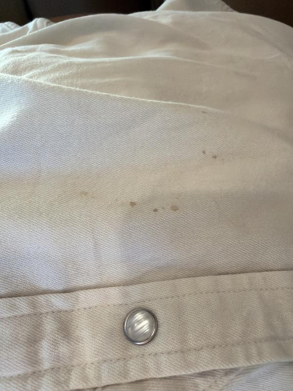 Arrived with blood or mud on it.