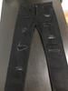 black skinny jeans with holes in knees