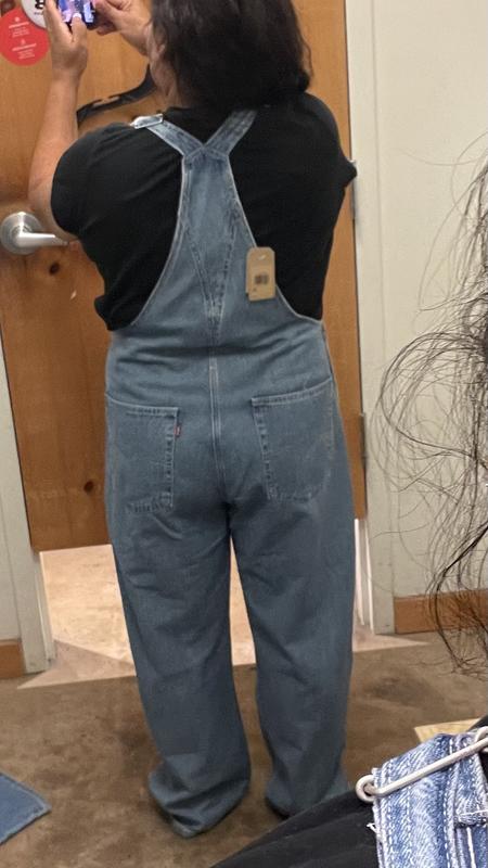 In the dressing room, trying on my new overalls loving the color I’m a large but like to size up XL