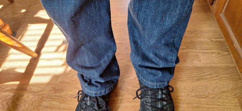 You can see from the photo the outer seam is coming almost down the middle of the front of the leg.