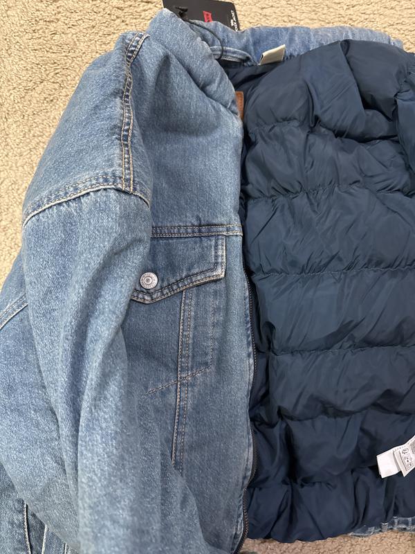 No padding or fluff, not puffy, floppy jacket it’s worse in person. Used item sent to me