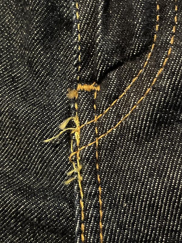 Sloppy stitching around fly
