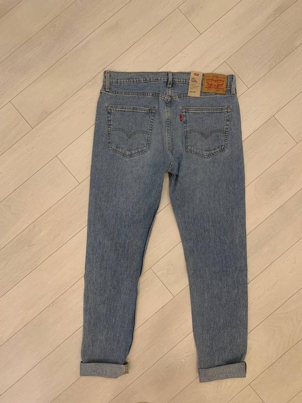 Levi's 512 slim taper jeans with distressing in light blue wash