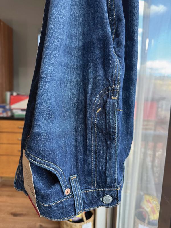 Stripped faded area of what were supposed to be uniform dark color Jeans according to Levis web photo. These still have the tag on and have not been worn by me, but 6 months old. Not what I wanted.