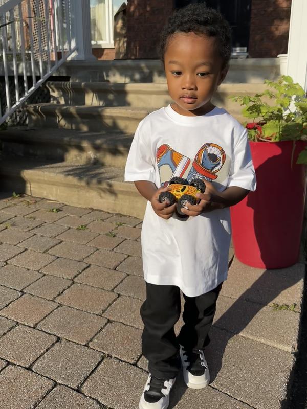 With Jordan sneakers and a cool T.