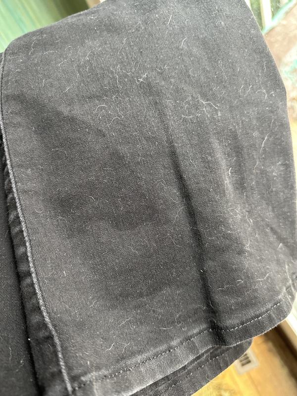 Yes, I have dogs. The lint mostly wipes off with a sponge, but something else always sticks to this fabric.