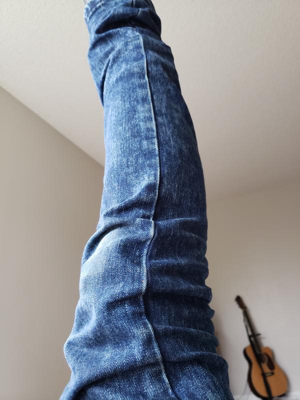 Leg up in the air, picture of the pattern, side of pants in overcast day lighting
