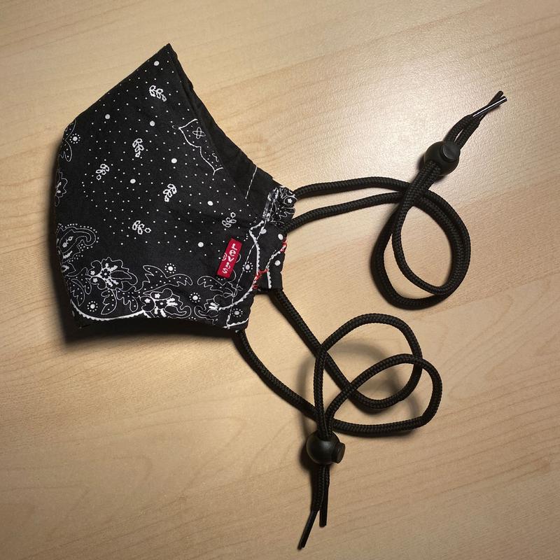 Modified mask with over-the-head straps.