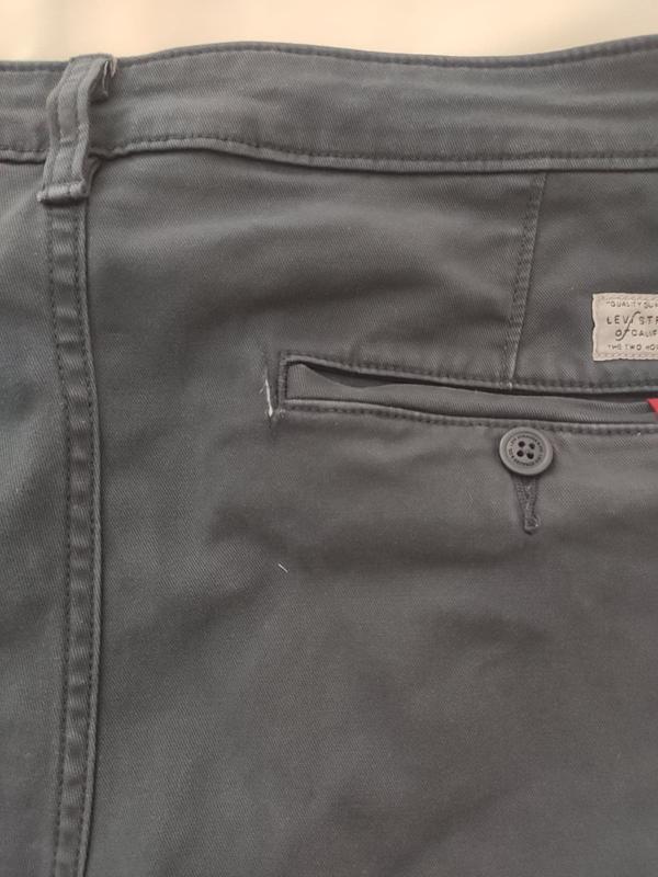 Tear next to the rear pocket