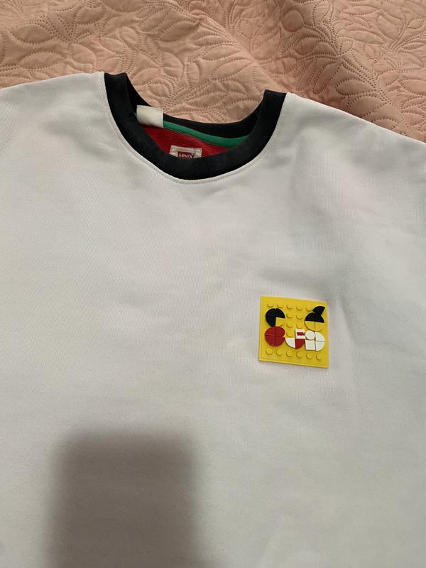 Stains all over white from the sleeves, black faded
