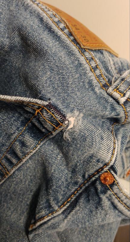 Tears at back pocket