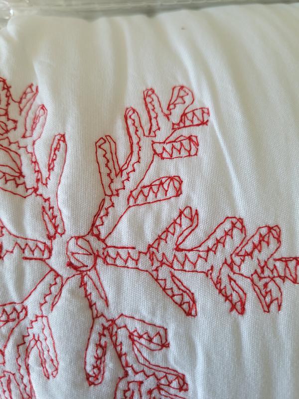 Red snowflake design stitched