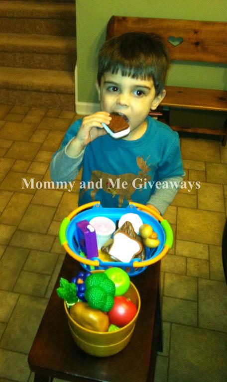 My son checking out the Deluxe Market Set