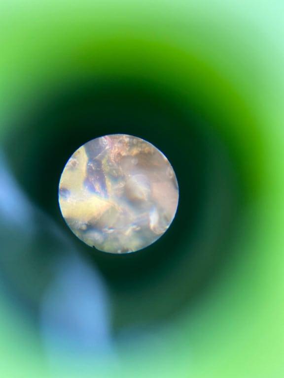 Trying to capture what we could see through the scope by lining up my phone camera with the hole!