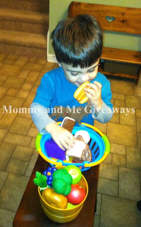 My son checking out the Deluxe Market Set