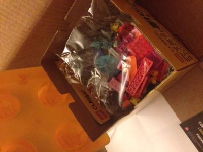 the cardboard box under the plastic lid