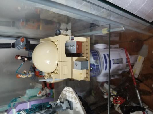 Figures inside. Compact. Opens up.