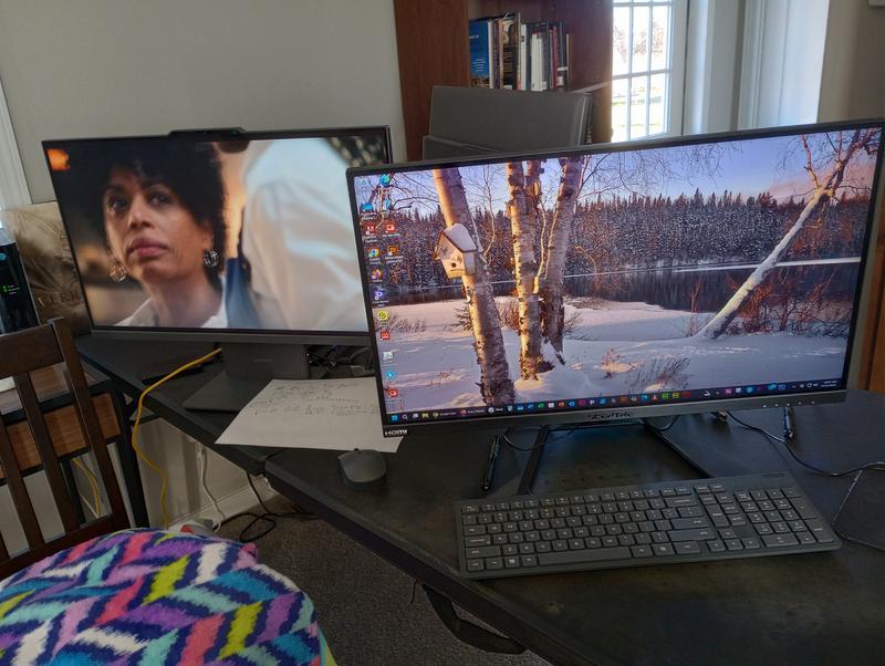 The computer, projector, and the old 2016 Lenovo computer in the background that started regularly shutting itself off because of Windows 10 no longer being serviced.