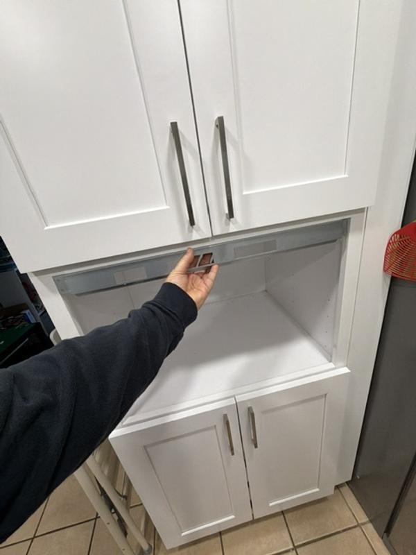 Fits inside cabinets width, can't figure out how to attach