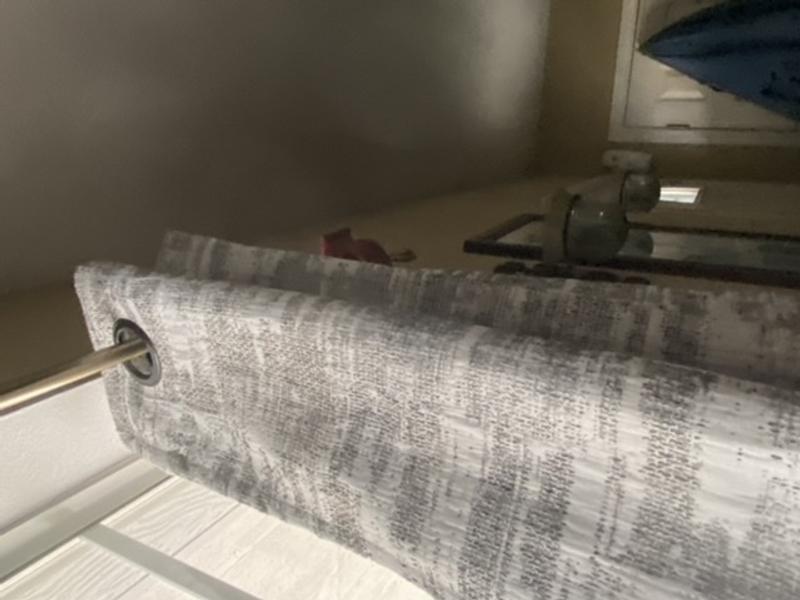 Curtains panels have large grommets, making them easy to hang.