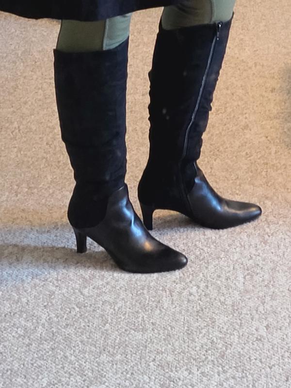 Boots in a dirty mirror.