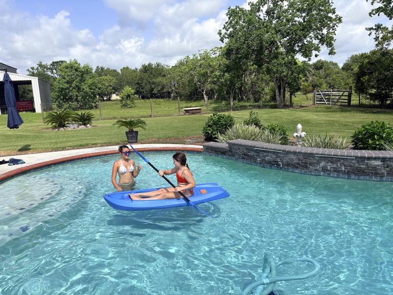 My big sis teaching me in the pool before we get into the pond!