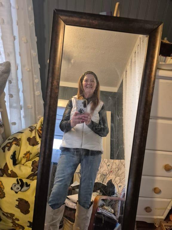 With a puffy vest. And a pair of lucky jeans and beige boots:).