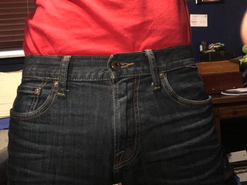 Crooked pants, belt loops, zipper and button not centered.