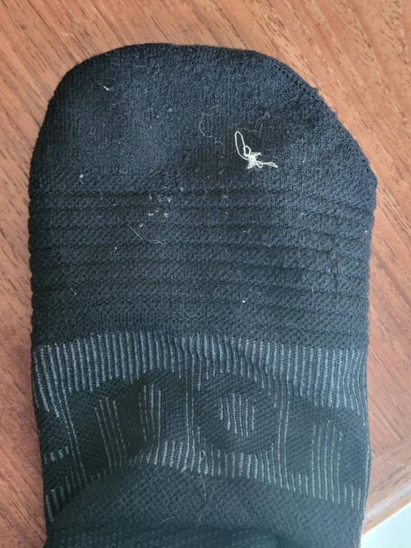 Elastic coming through sock bottom