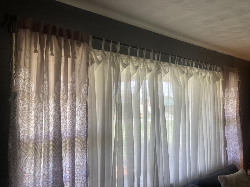 Hanging with Sheers -- I like the look with the light coming through.