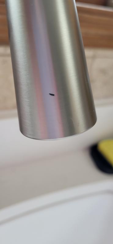 Small ding in faucet.