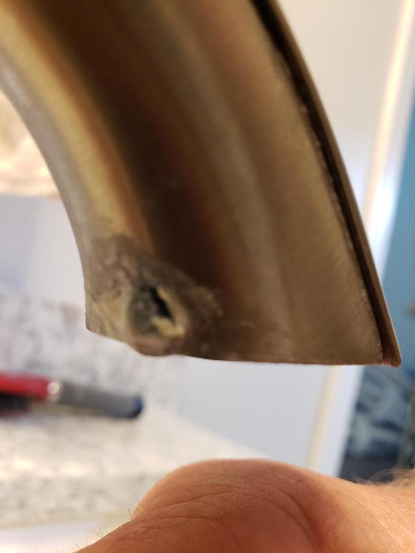 Pitting on the back of bathroom faucet that is less than 3 years old.