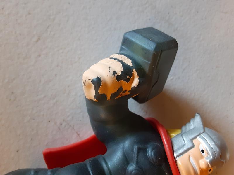 Thor's hand with missing paint
