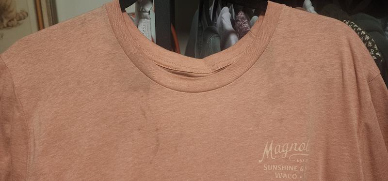 Dark gray stains along the collar