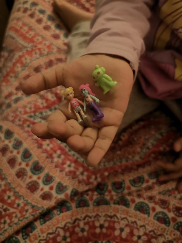 The three figurines included in my 3 yr old hand just to put into perpective their size