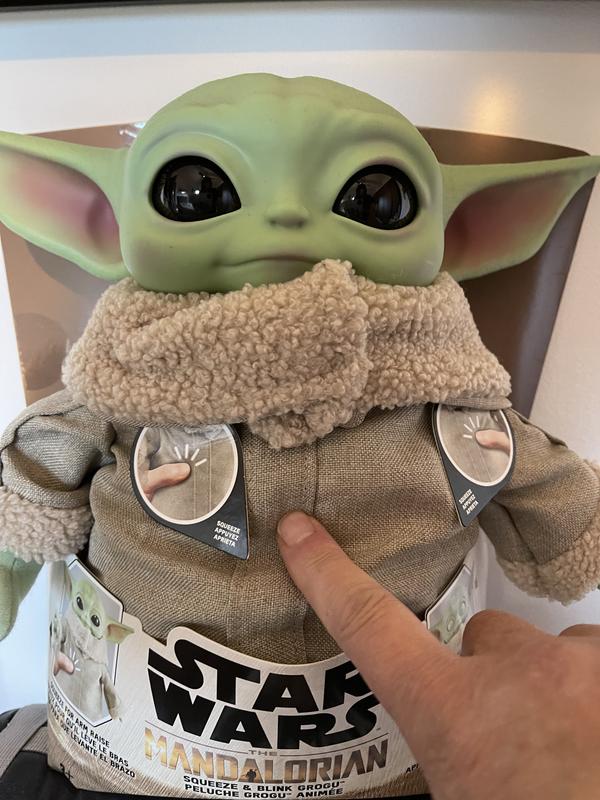 Press his belly for action and to hear him talk.