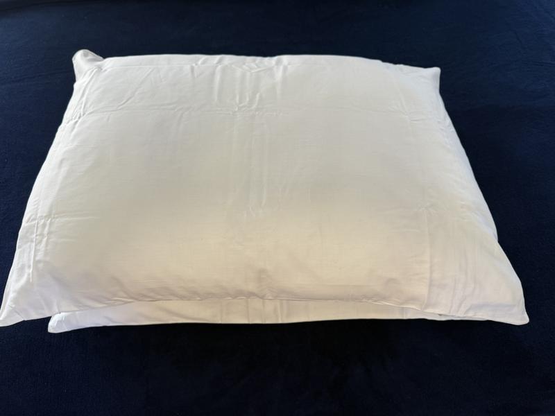 A thin soft pillow and a thicker medium firm pillow
