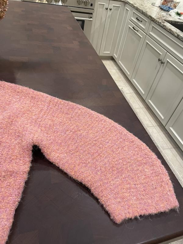 Boxy shape with wide arms that taper to the wrist