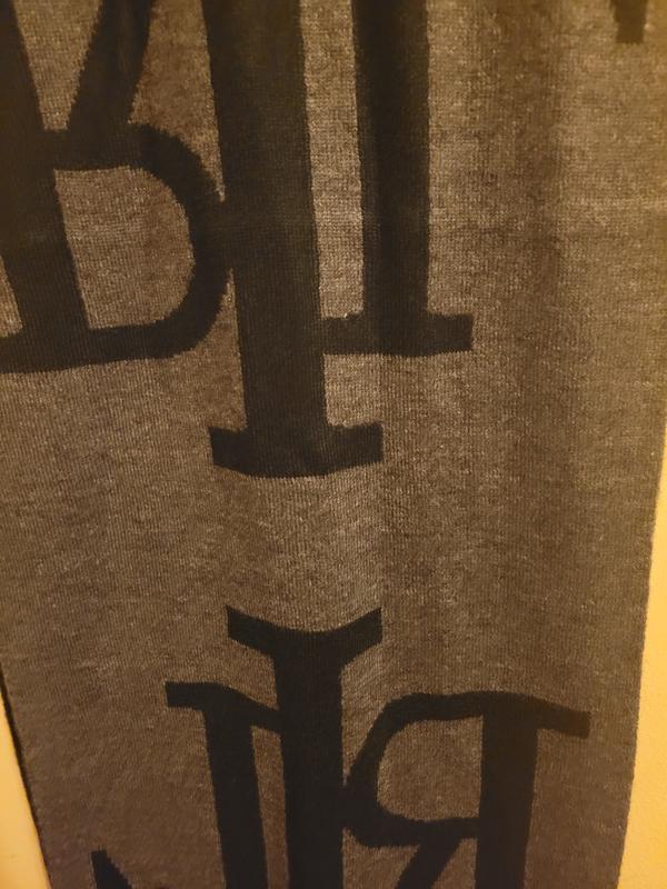 Grey side with black letters