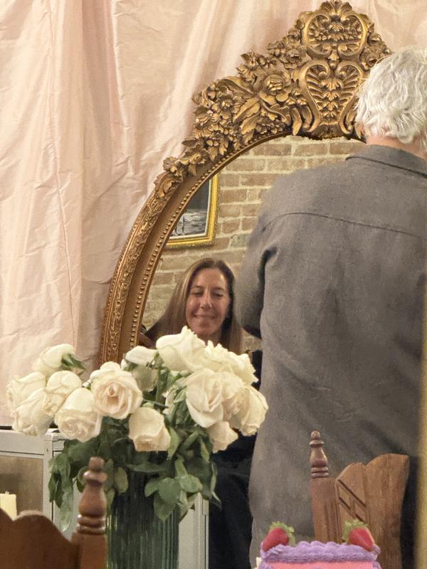 Zoom in and you can see Donna Karan in the mirror!