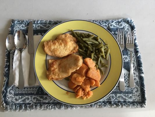 Breaded chicken breast, green beans and yams.