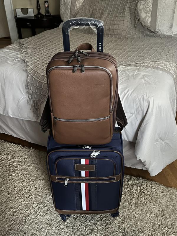 Paired with a Leather Samsonite backpack that has a strap to go over the suitcase handle.