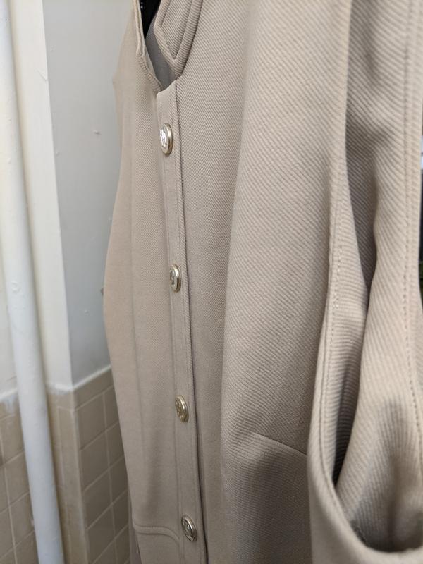 Inside material by armholes don't lay flat