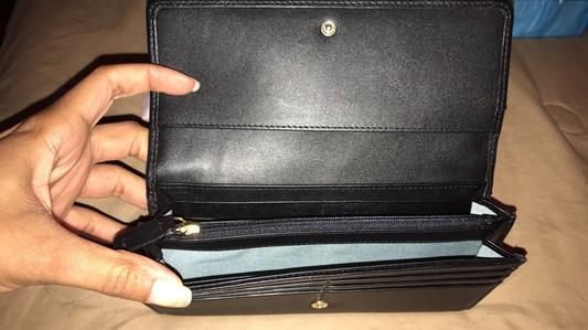 inside of wallet, zip pocket and open pockets for money, etc