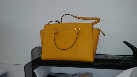 My purse is the center attraction on my desk at work